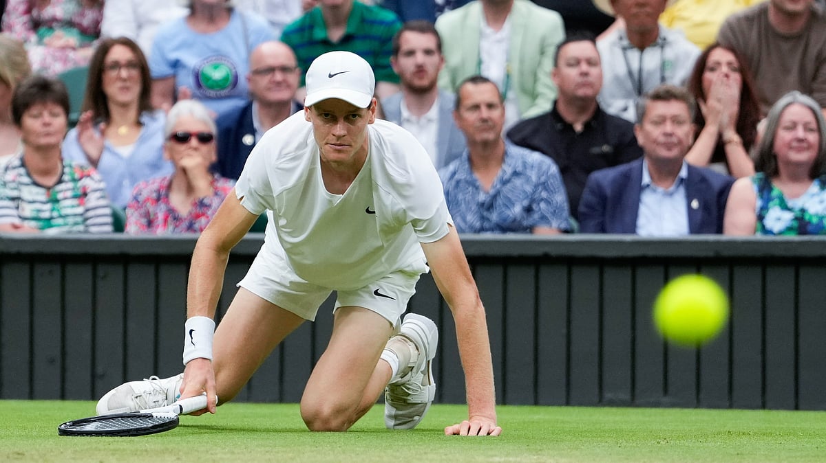 Jannik Sinner of Italy falls during his quarterfinal match against Daniil Medvedev of Russia at the Wimbledon tennis championships in London, Tuesday, July 9, 2024. -  (AP Photo/Alberto Pezzali)